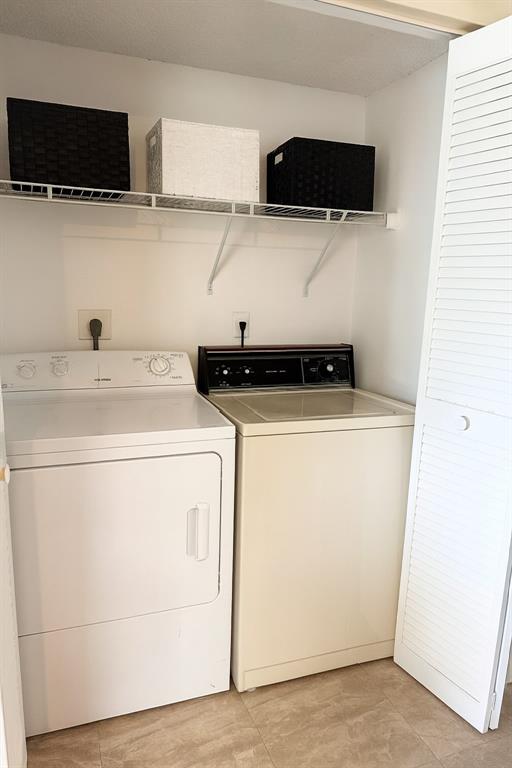9778 Nickels Boulevard, Unit 504 Boynton Beach, FL 33436 - Photo 10 of 31 a utility room with dryer and washer