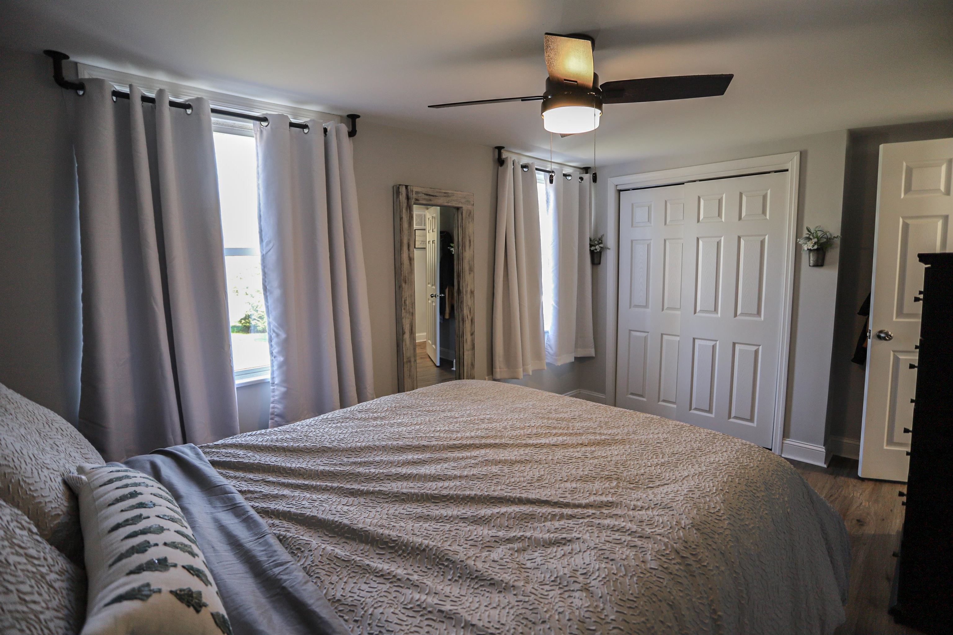 101 Sunset Road Corbin City, NJ 08270 - Photo 14 of 21 a bedroom with a bed and a mirror