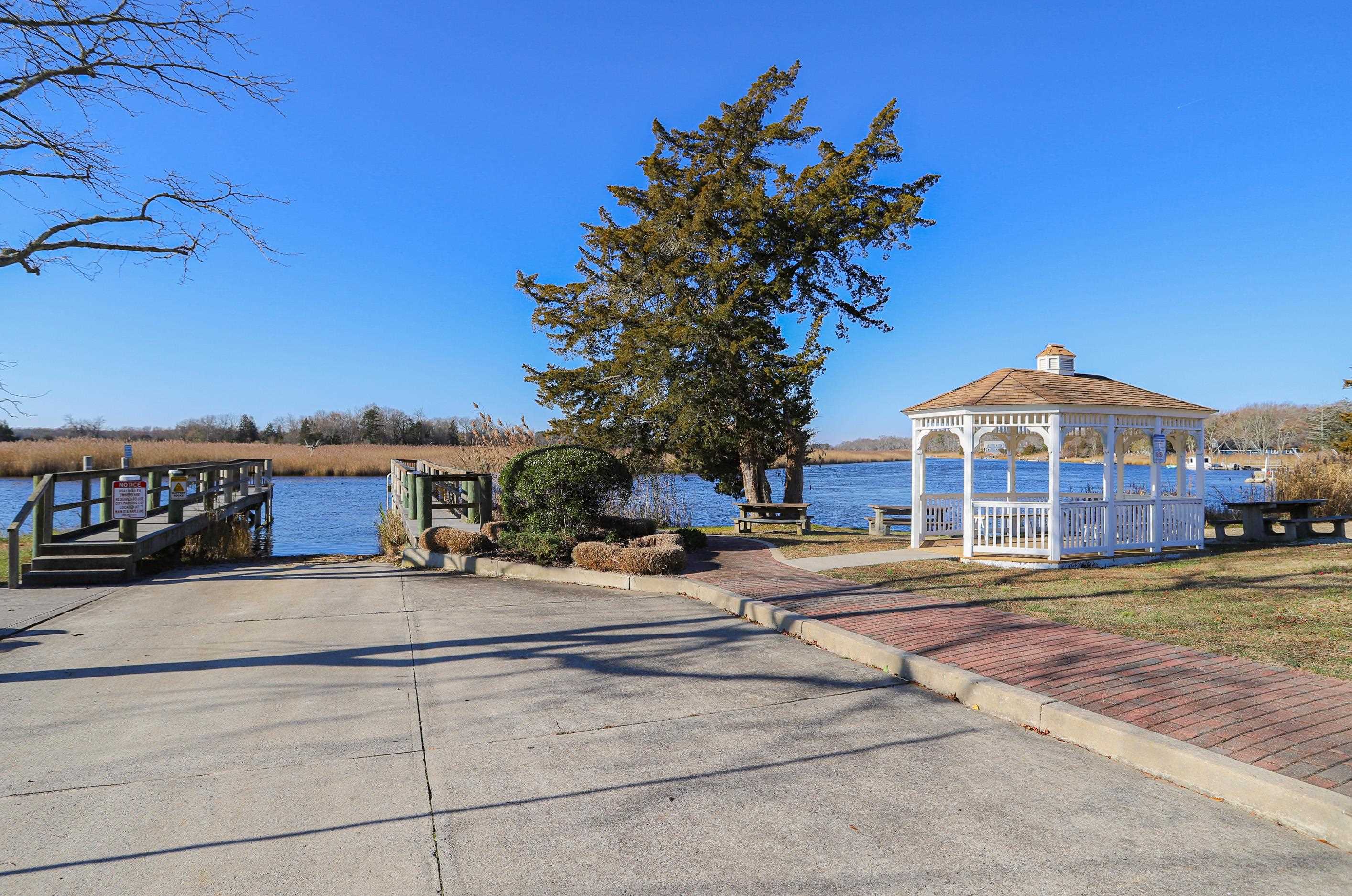 101 Sunset Road Corbin City, NJ 08270 - Photo 20 of 21 a front view of a building with a garden
