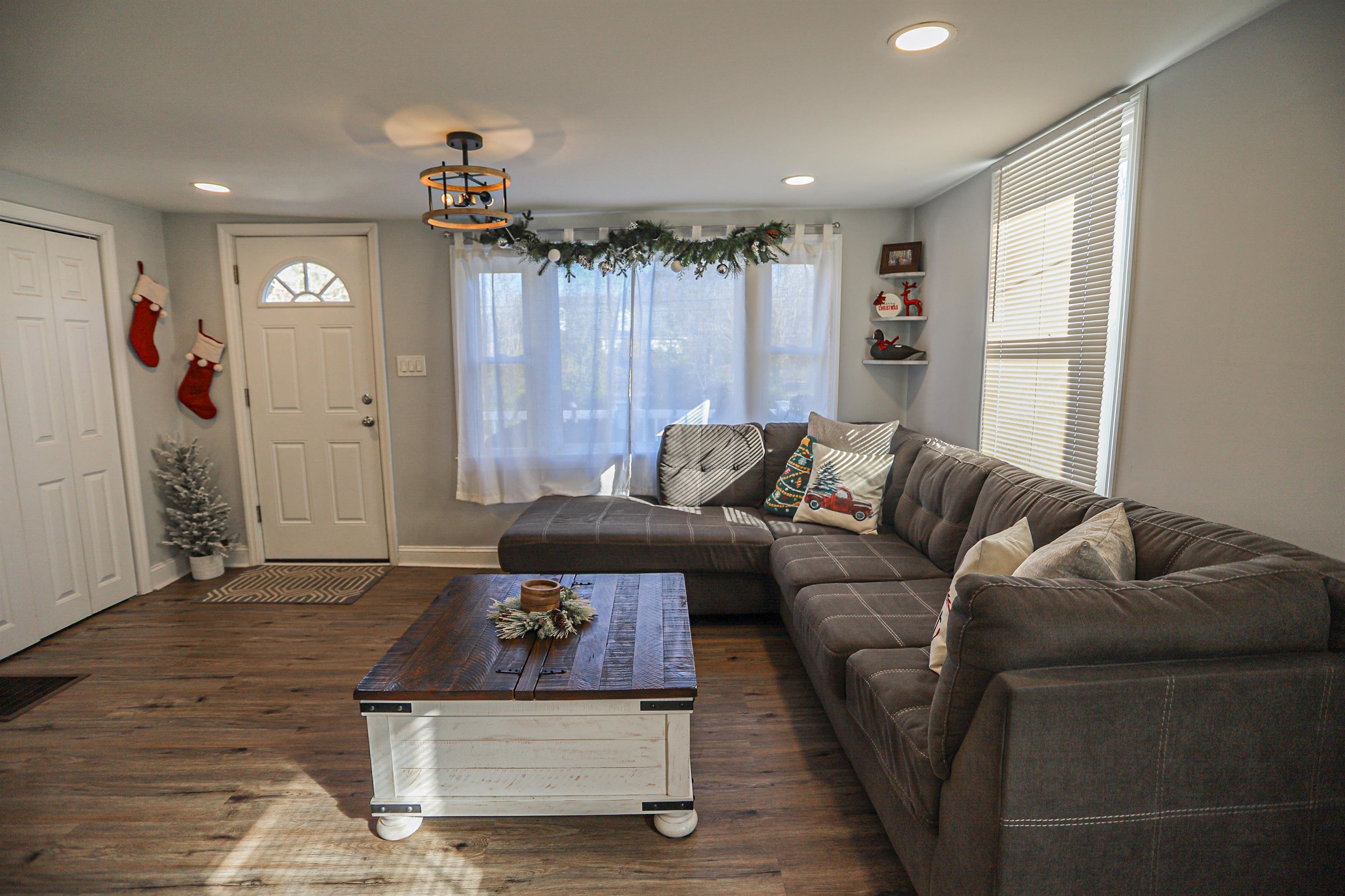 101 Sunset Road Corbin City, NJ 08270 - Photo 4 of 21 a living room with furniture and a chandelier