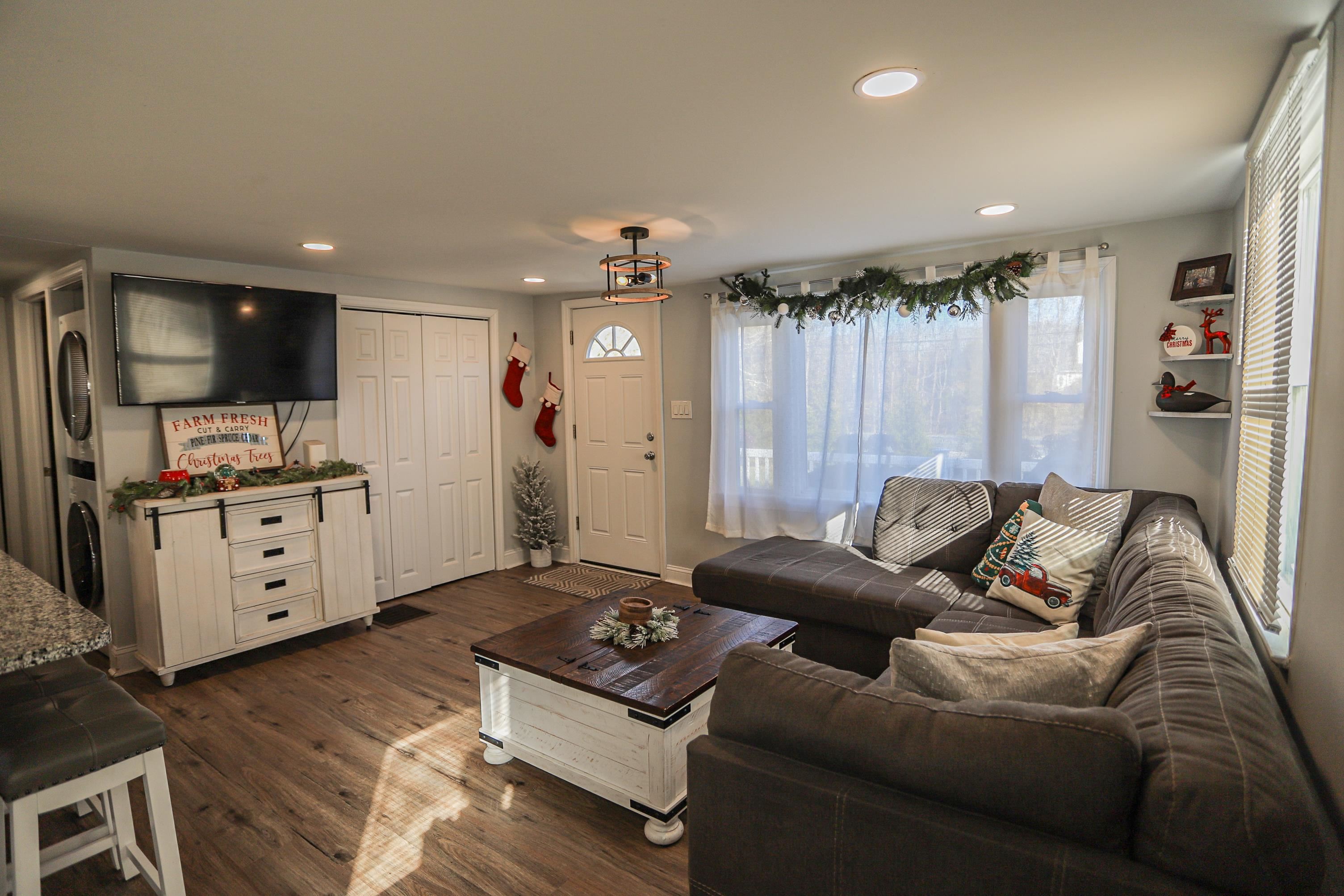 101 Sunset Road Corbin City, NJ 08270 - Photo 5 of 21 a living room with furniture and a flat screen tv