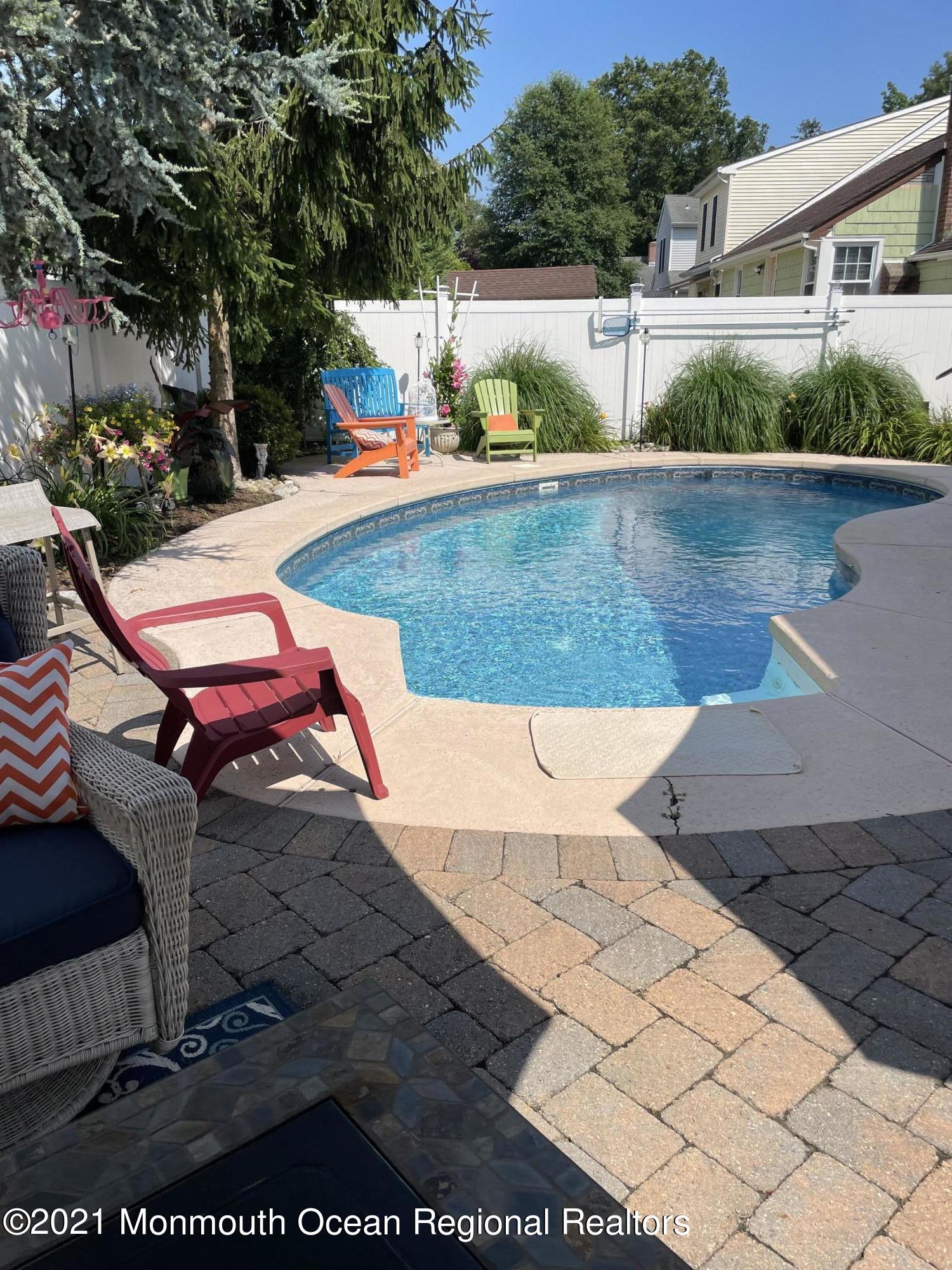 2311 Pineneedle Road Point Pleasant, NJ 08742 - Photo 3 of 5 a view of a patio with table and chairs with wooden fence