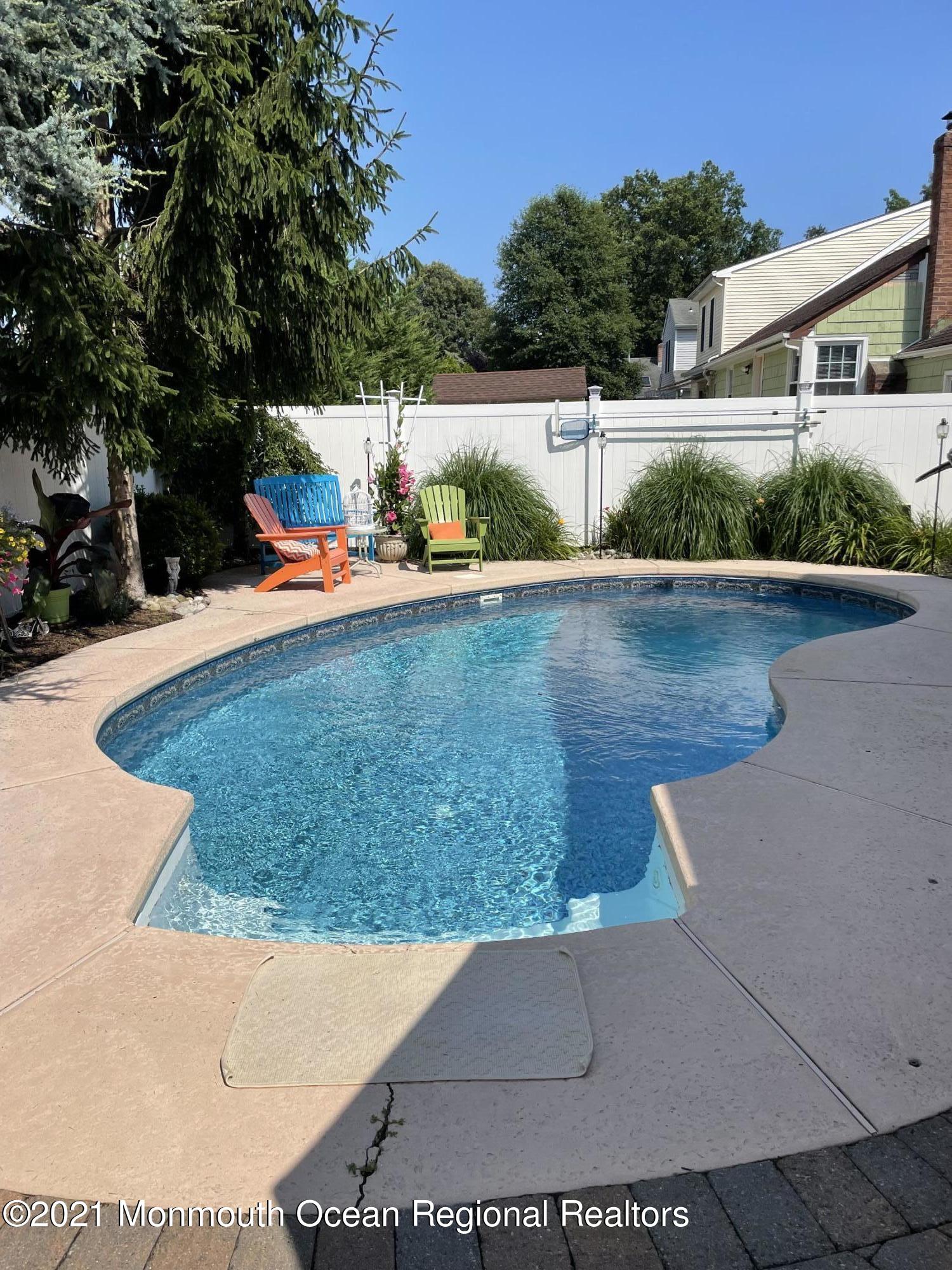2311 Pineneedle Road Point Pleasant, NJ 08742 - Photo 4 of 5 a view of a swimming pool with a patio