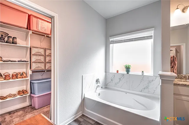 a bathroom with sink and a bathtub