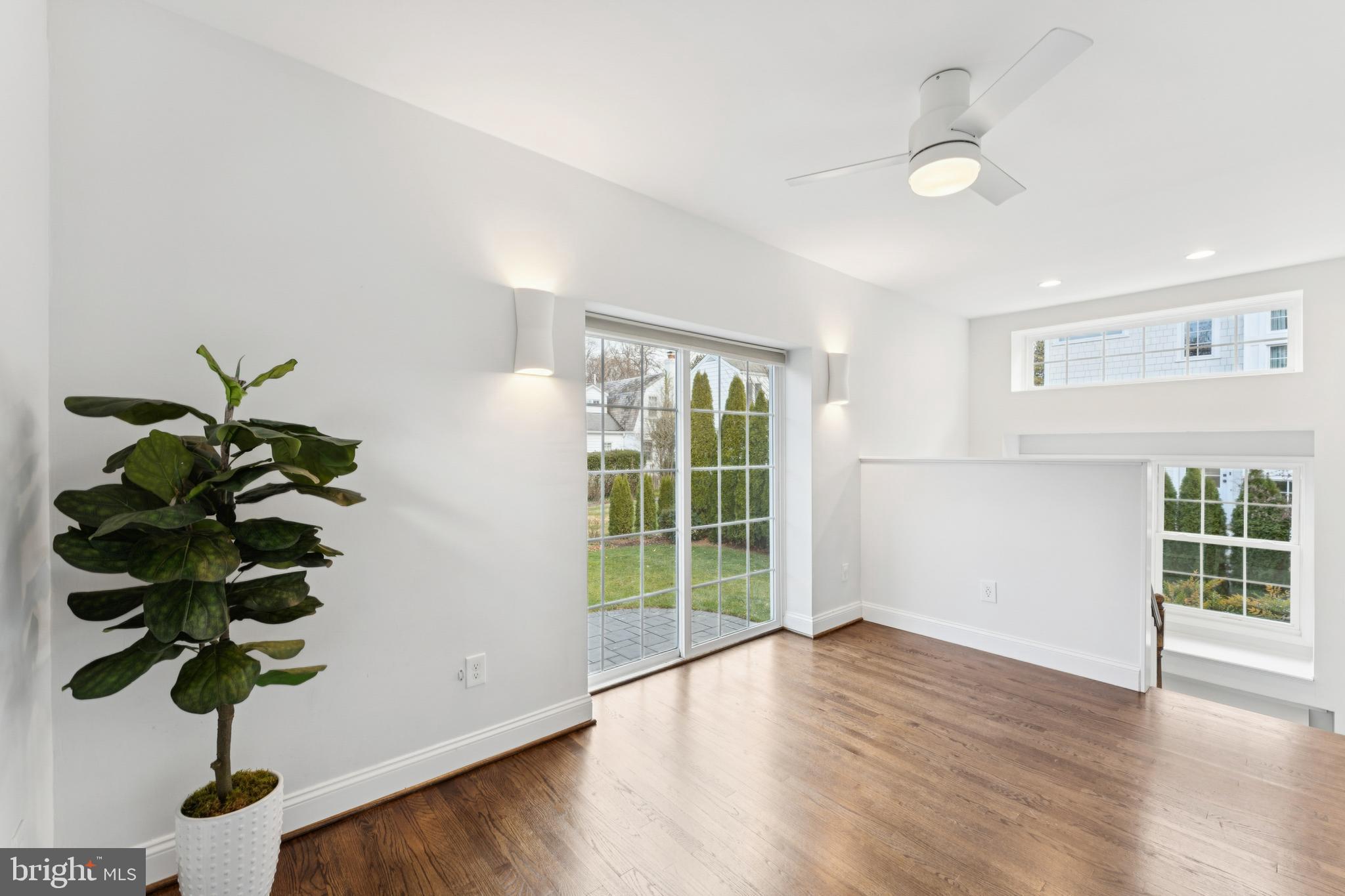 3515 Taylor Street Chevy Chase, MD 20815 - Photo 15 of 40 a view of a room with wooden floor and small window