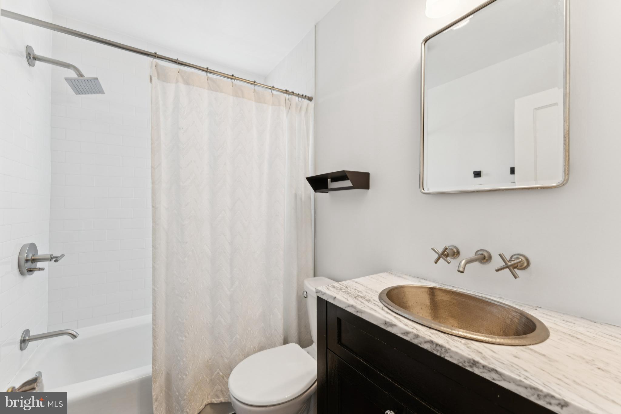 3515 Taylor Street Chevy Chase, MD 20815 - Photo 24 of 40 a bathroom with a granite countertop sink toilet and shower