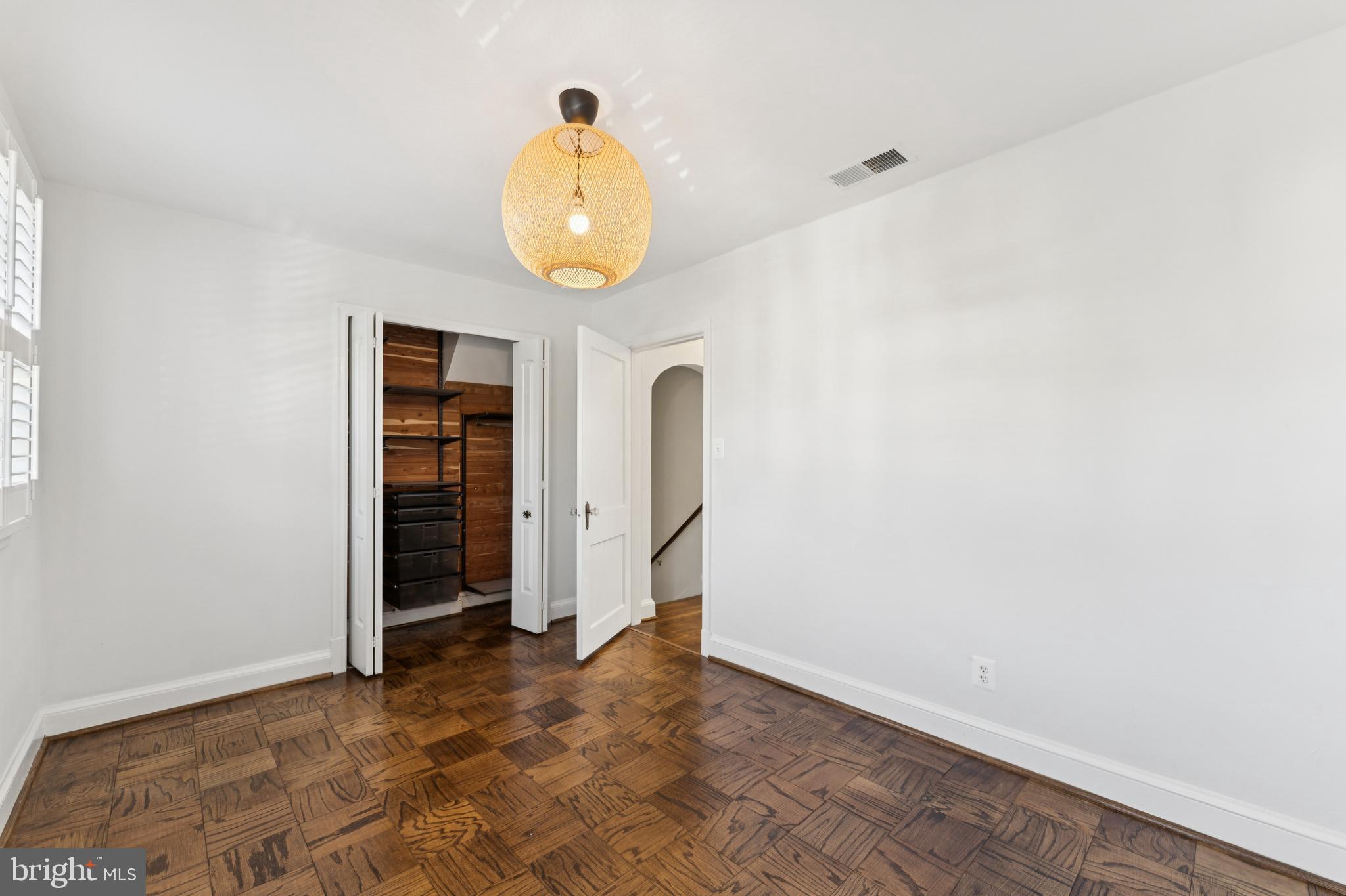 3515 Taylor Street Chevy Chase, MD 20815 - Photo 26 of 40 an empty room with wooden floor and window