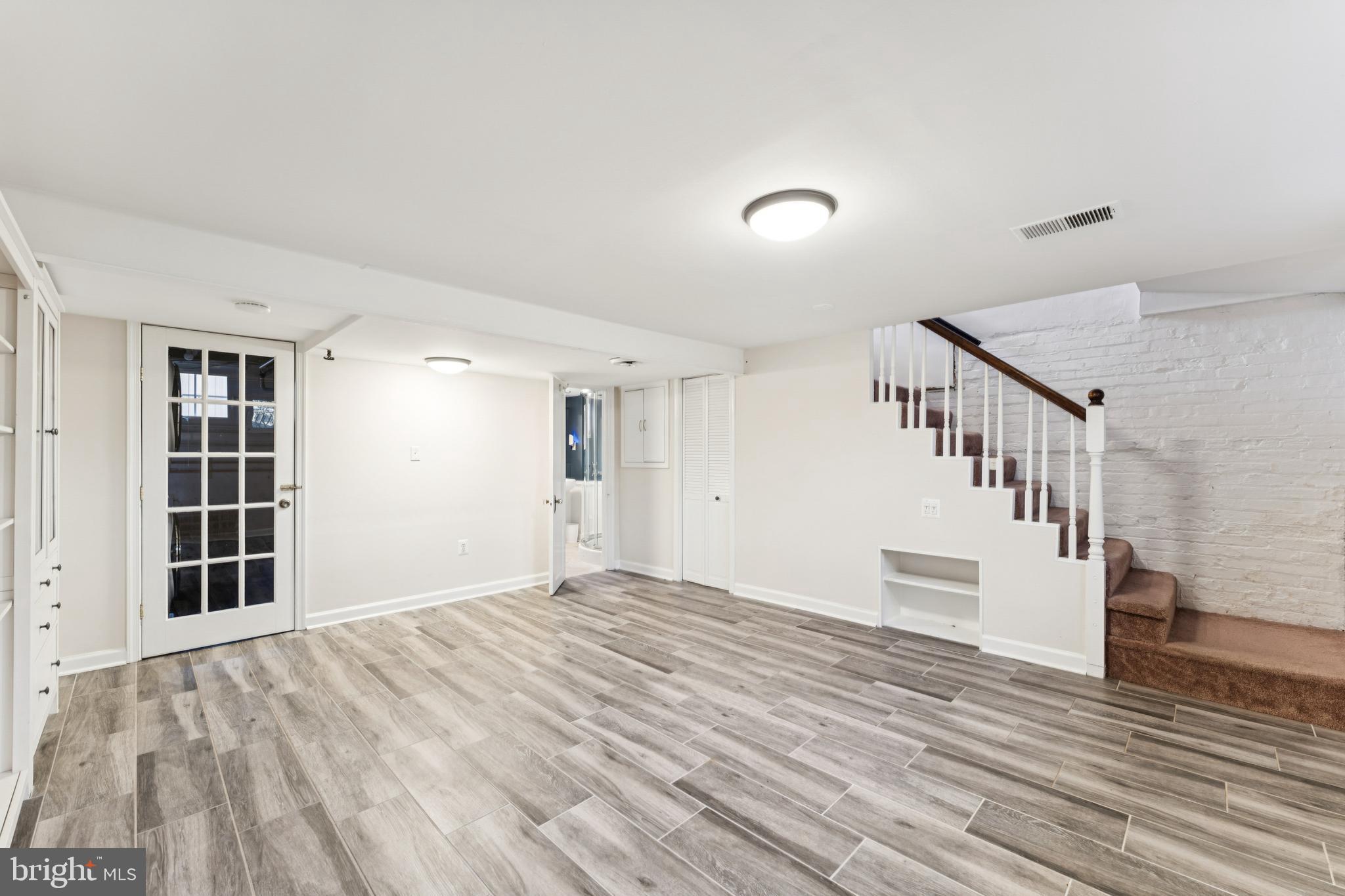 3515 Taylor Street Chevy Chase, MD 20815 - Photo 29 of 40 a view of empty room with wooden floor and fan