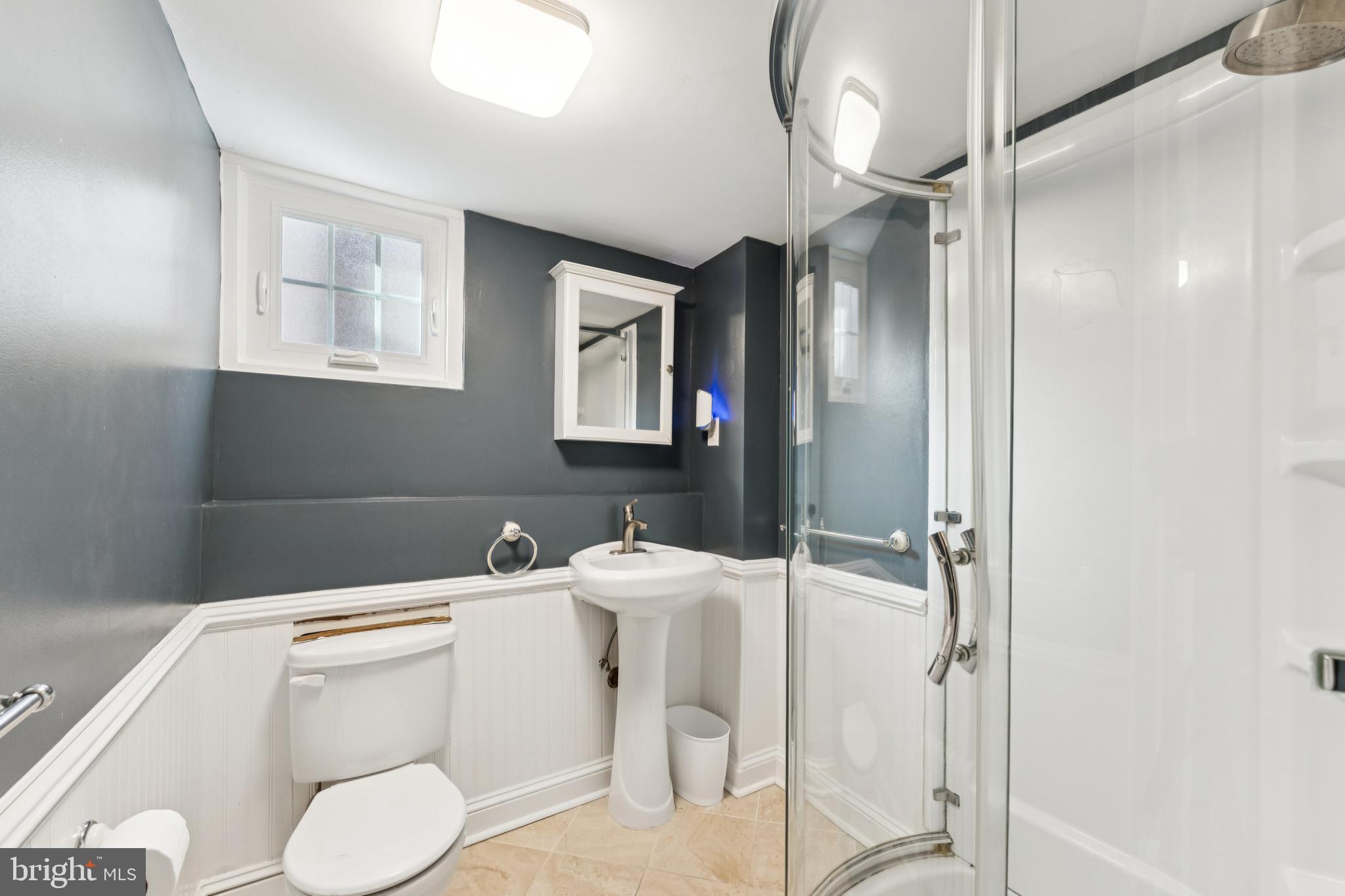 3515 Taylor Street Chevy Chase, MD 20815 - Photo 31 of 40 a bathroom with a sink toilet and shower