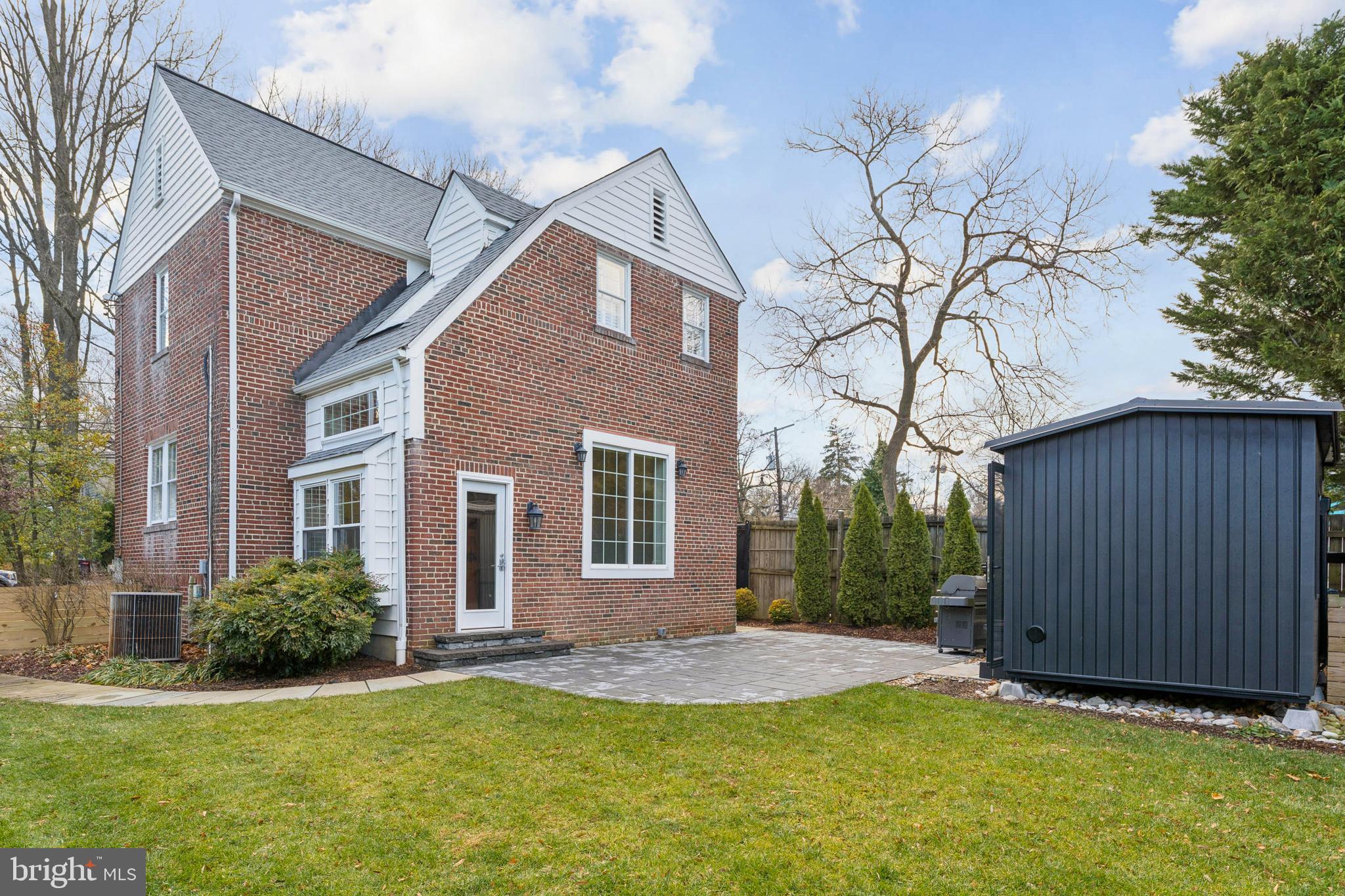 3515 Taylor Street Chevy Chase, MD 20815 - Photo 33 of 40 a view of a house with a yard and wooden fence