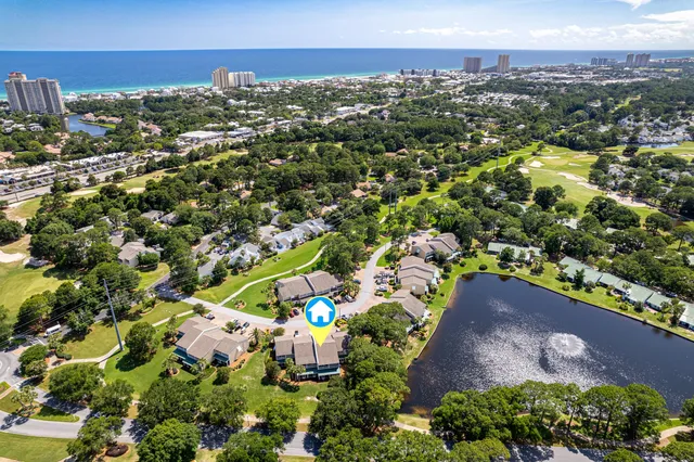 an aerial view of residential houses with outdoor space and street view