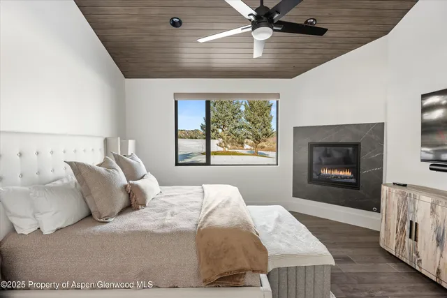 a spacious bathroom with a granite countertop sink mirror and a bathtub