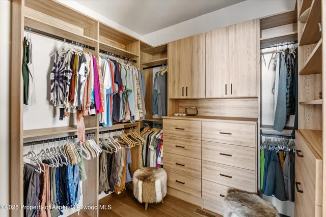 a bed room with a bed and a chair