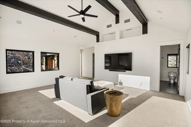 a bathroom with a sink vanity granite and a toilet