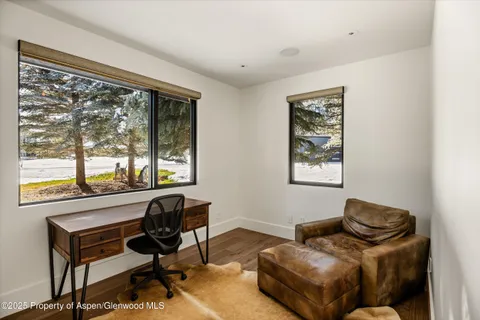 a view of a bench and wooden door