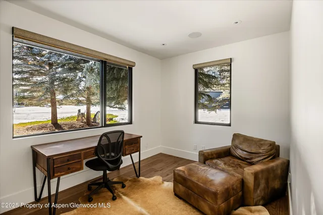 a view of a bench and wooden door