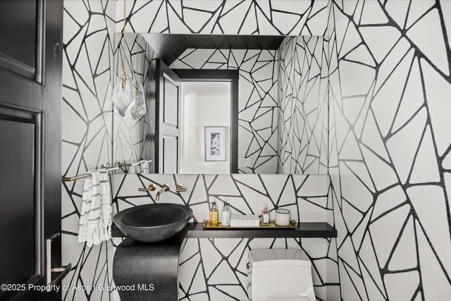 a view of living room with furniture and a refrigerator