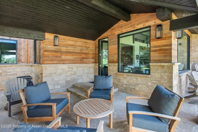 a aerial view of a house with swimming pool and a yard