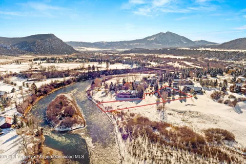 a view of a city with mountains in the background
