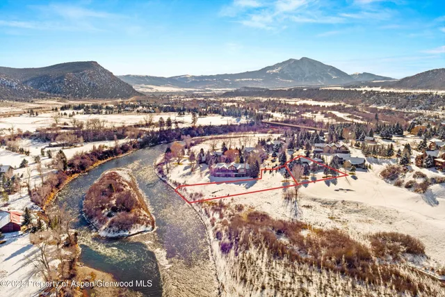 a view of a city with mountains in the background