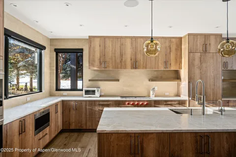 a kitchen with a sink and cabinets