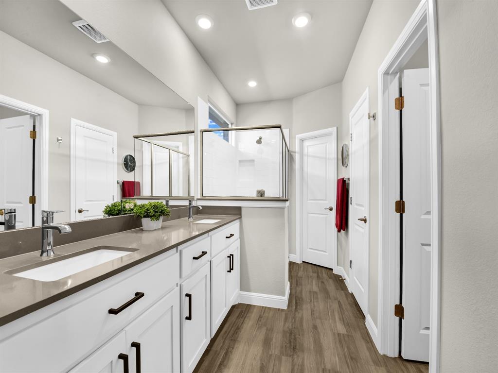 2364 Waggoner Rnch Drive Weatherford, TX 76087 - Photo 20 of 30 a spacious bathroom with a double vanity sink mirror and shower