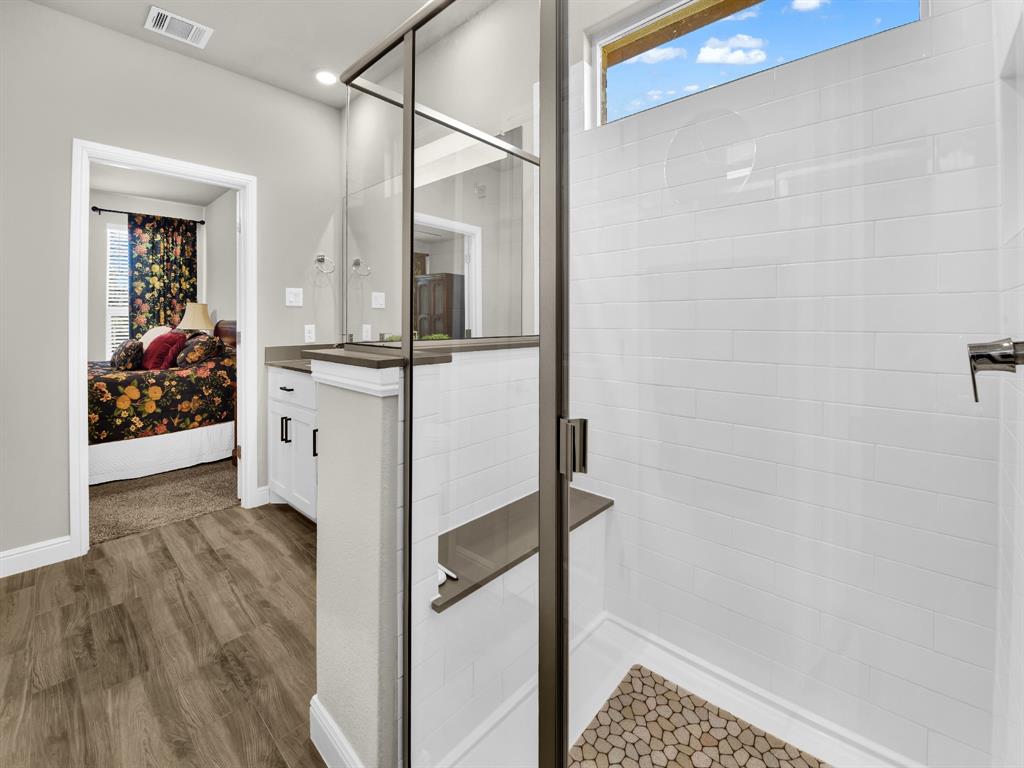2364 Waggoner Rnch Drive Weatherford, TX 76087 - Photo 21 of 30 a bathroom with a sink and mirror