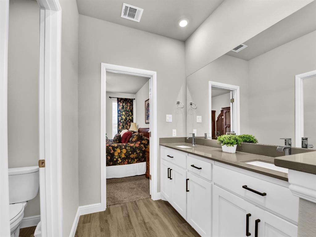 2364 Waggoner Rnch Drive Weatherford, TX 76087 - Photo 22 of 30 a spacious bathroom with a double vanity sink and mirror