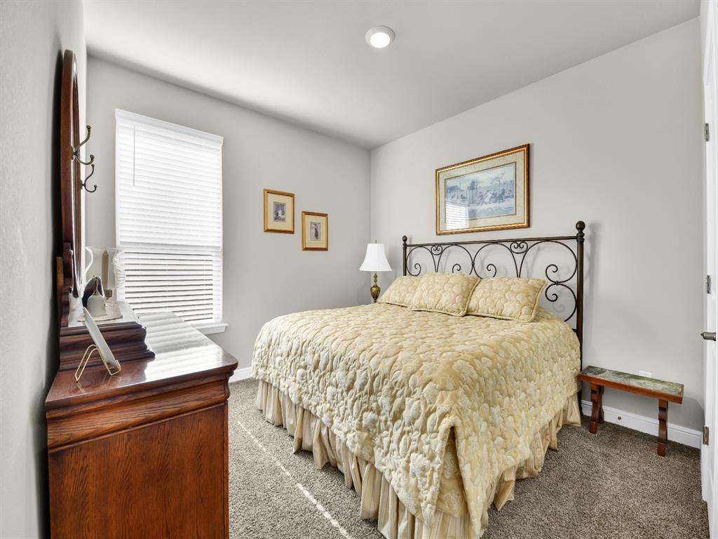 2364 Waggoner Rnch Drive Weatherford, TX 76087 - Photo 26 of 30 a bedroom with a bed and a night stand