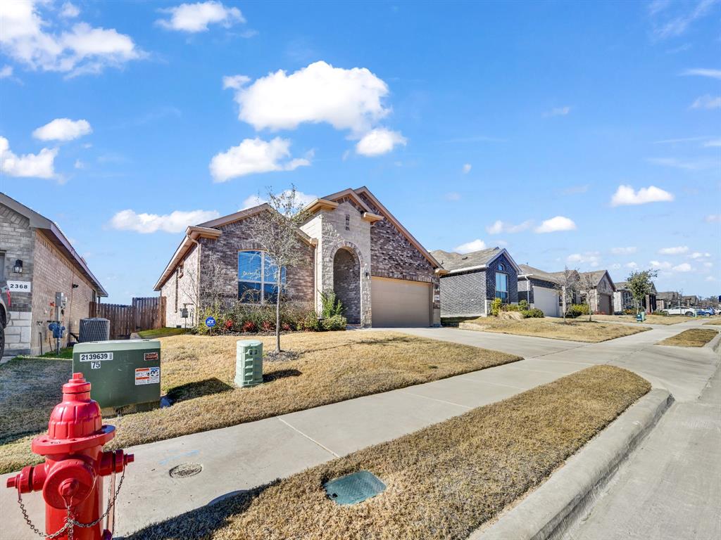 2364 Waggoner Rnch Drive Weatherford, TX 76087 - Photo 3 of 30 a front view of a house with a yard