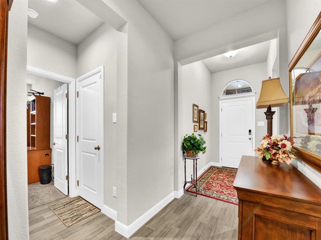 2364 Waggoner Rnch Drive Weatherford, TX 76087 - Photo 6 of 30 a living room with furniture flowerpot and wooden floor