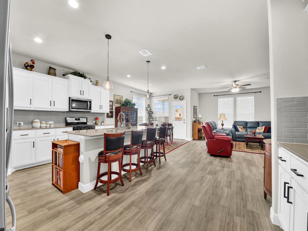 2364 Waggoner Rnch Drive Weatherford, TX 76087 - Photo 10 of 30 a large kitchen with lots of counter space and stainless steel appliances