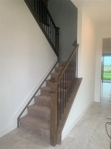 an empty room with a empty space and windows