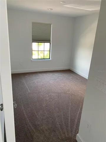 a white toilet sitting next to a sink
