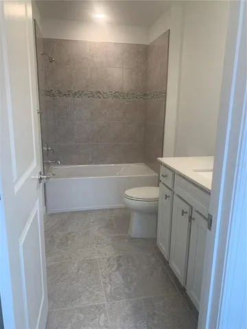 a view of an empty room and a window