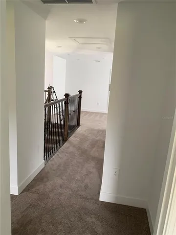 a view of a room that has a window in it