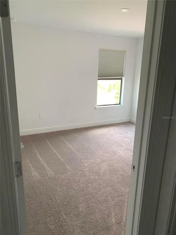 a living room with furniture a rug and a flat screen tv