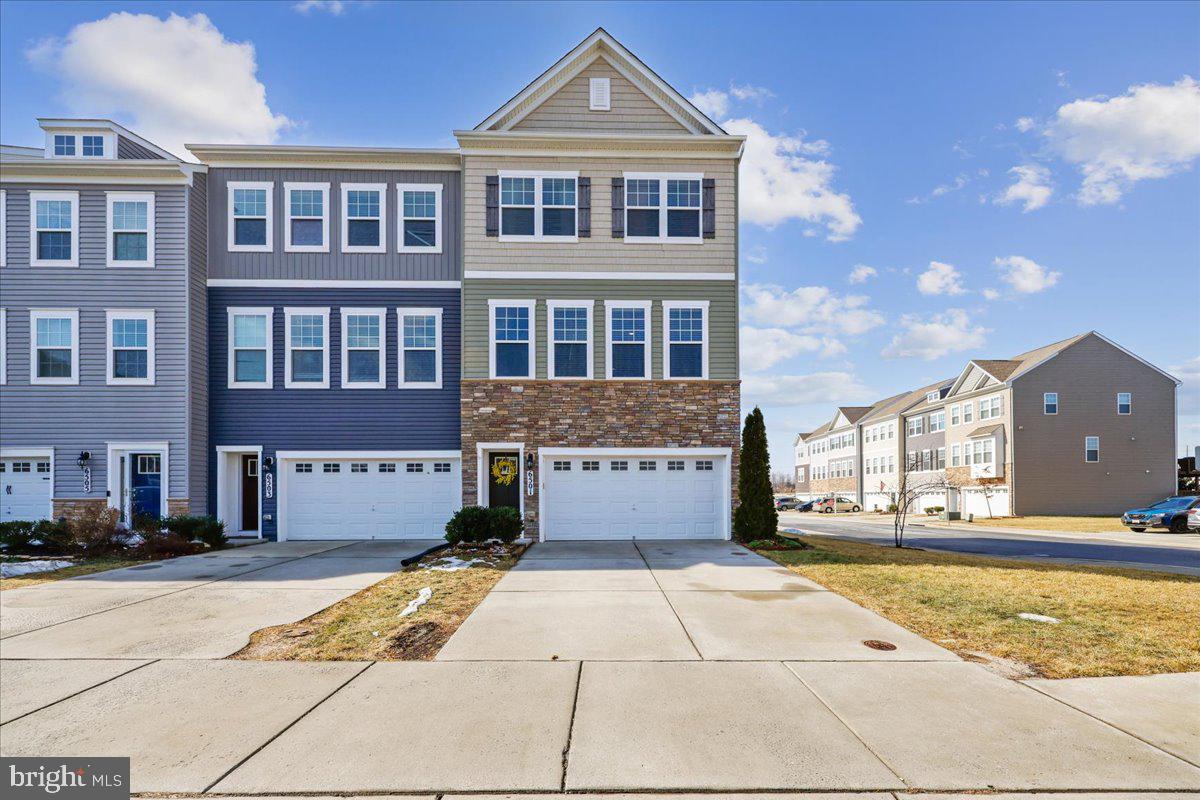6501 Britannic Place Frederick, MD 21703 - Photo 2 of 64 a front view of a house with a yard