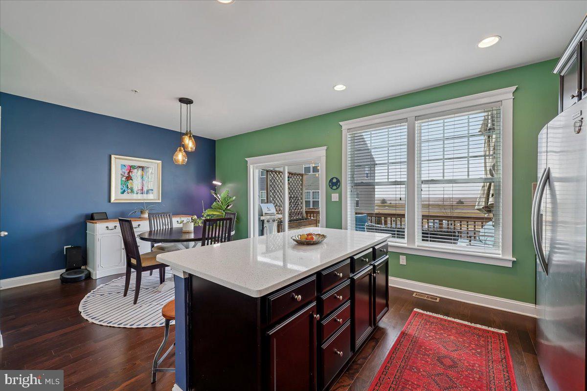 6501 Britannic Place Frederick, MD 21703 - Photo 21 of 64 a dining room with wooden floor and windows