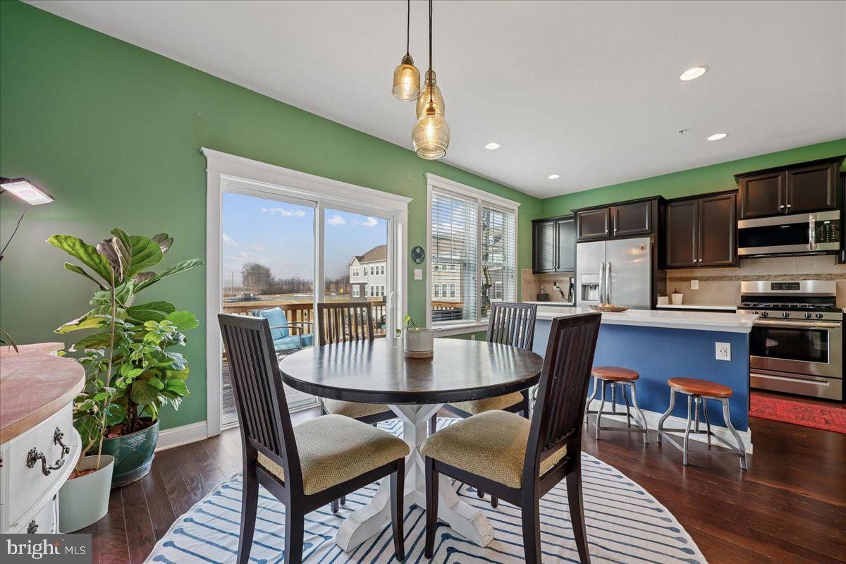 6501 Britannic Place Frederick, MD 21703 - Photo 24 of 64 a dining room with furniture and wooden floor