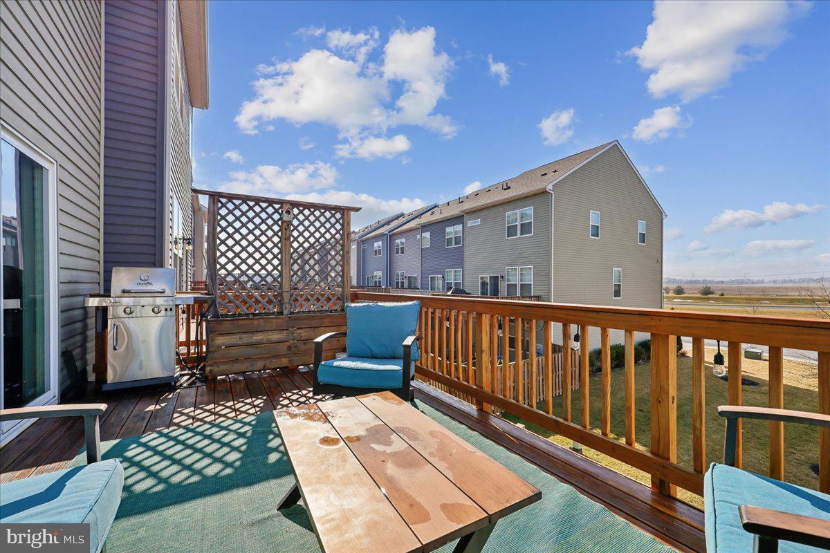 6501 Britannic Place Frederick, MD 21703 - Photo 27 of 64 a view of a chairs setting in the back yard of the house