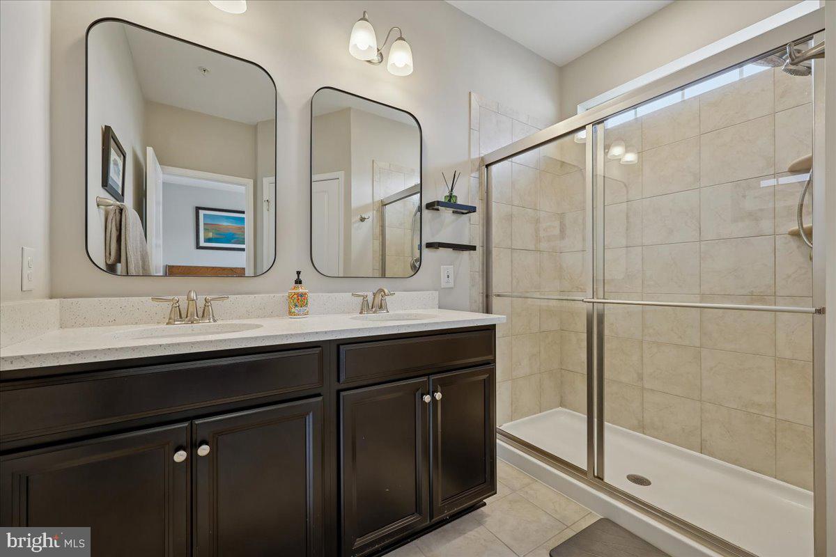 6501 Britannic Place Frederick, MD 21703 - Photo 37 of 64 a bathroom with a double vanity sink mirror and double