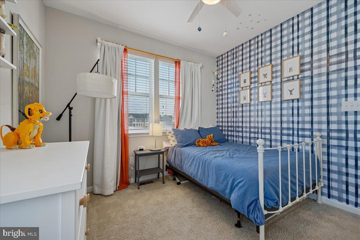 6501 Britannic Place Frederick, MD 21703 - Photo 38 of 64 a bedroom with a bed and a table