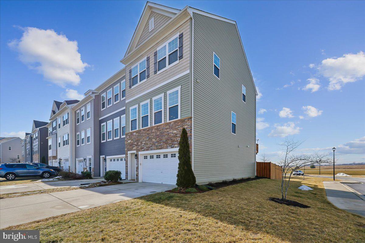 6501 Britannic Place Frederick, MD 21703 - Photo 4 of 64 a view of a building with many windows