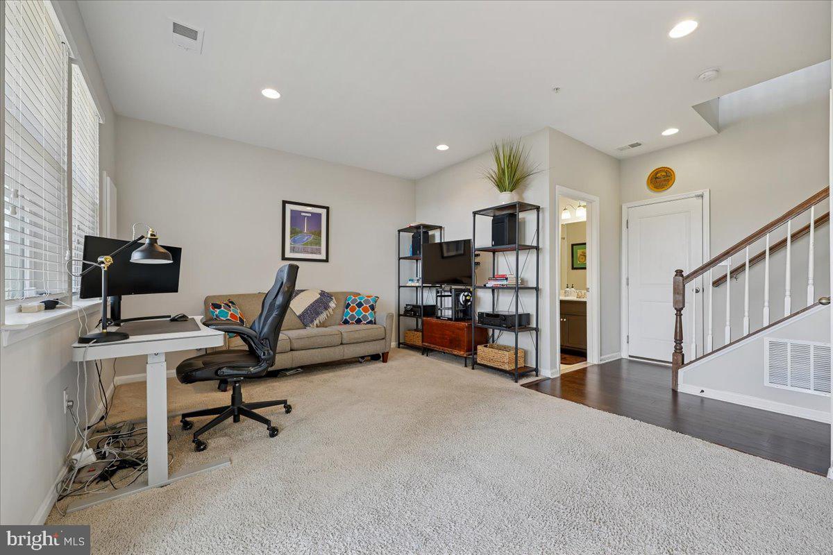 6501 Britannic Place Frederick, MD 21703 - Photo 52 of 64 a view of a livingroom with workspace and a window