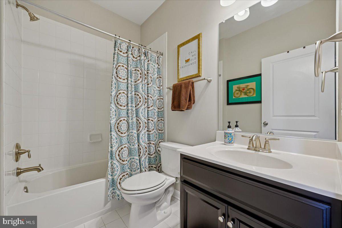 6501 Britannic Place Frederick, MD 21703 - Photo 53 of 64 a bathroom with a sink a toilet and shower