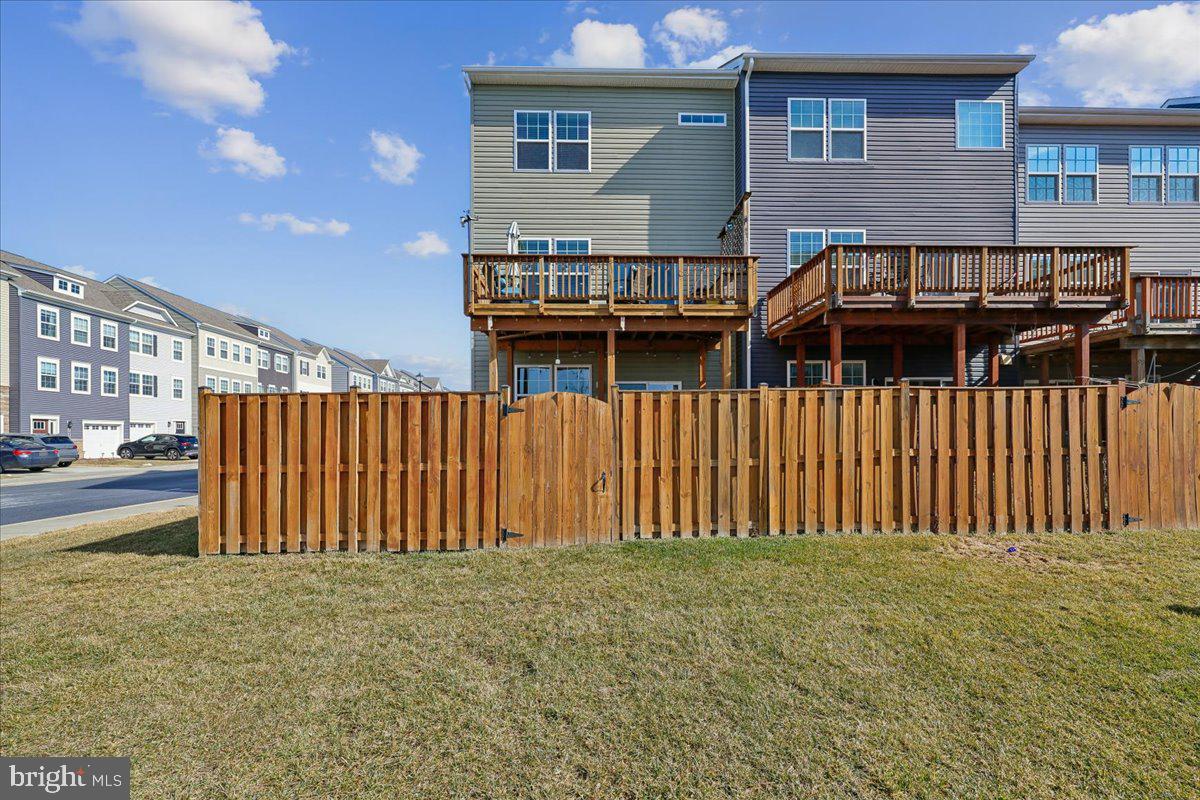 6501 Britannic Place Frederick, MD 21703 - Photo 54 of 64 a view of a house with wooden fence