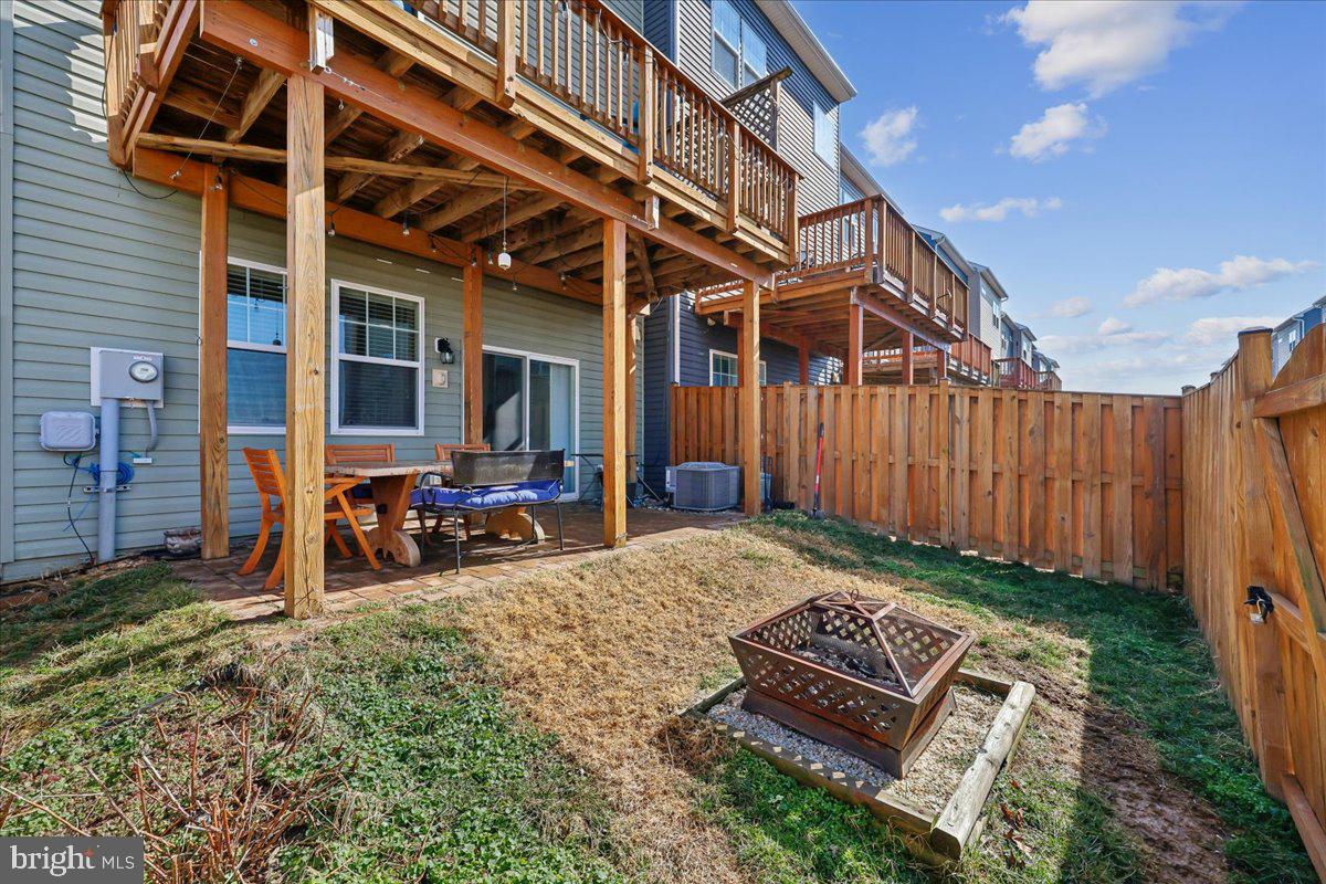 6501 Britannic Place Frederick, MD 21703 - Photo 58 of 64 a view of a backyard with sitting area and furniture