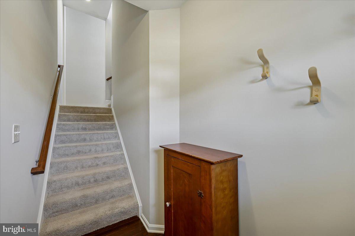 6501 Britannic Place Frederick, MD 21703 - Photo 7 of 64 a view of staircase with white walls