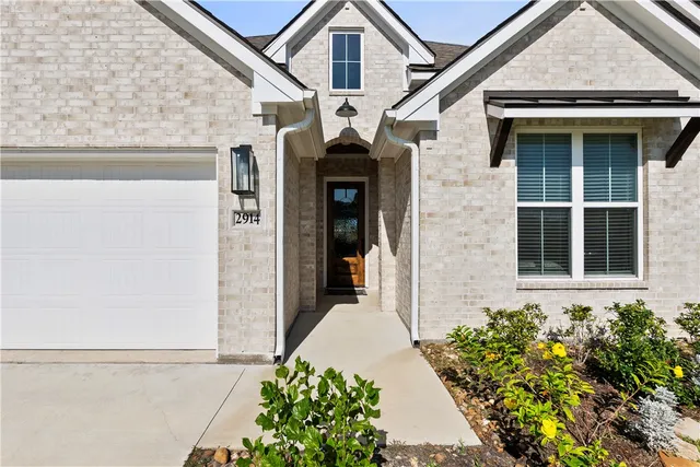 a front view of a house with yard